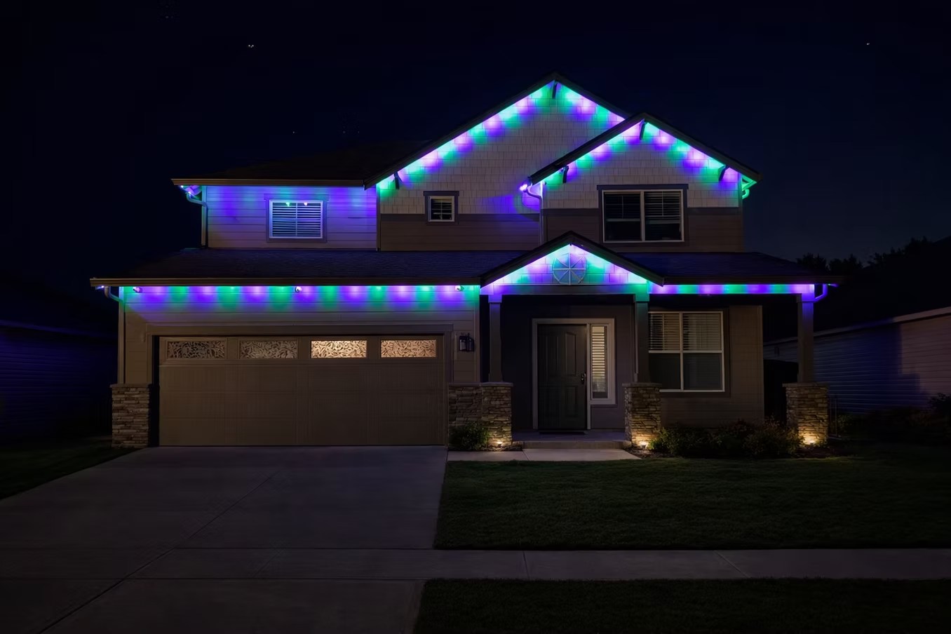 Purple, blue and green lights along a two-story home’s roofline